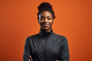 Wall Mural - Black sportswoman standing portrait smile.