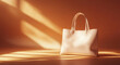 © mingnimit - stylish white tote bag is elegantly displayed on warm orange background, showcasing its sleek design and soft texture. interplay of light and shadow adds touch of sophistication