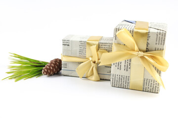 Wall Mural - Gifts wrapped in old newspaper on white background