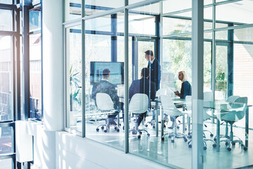 Wall Mural - Discussion, presentation and business people in office for financial review, teamwork and collaboration. Corporate, company and men and women in glass boardroom for feedback, statistics and meeting