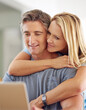 © ArcursForPI/peopleimages.com - Home, mature couple and love with laptop for insurance cover, online research and information. House, woman and man with thinking for investment, financial review and happy wife for support with hug