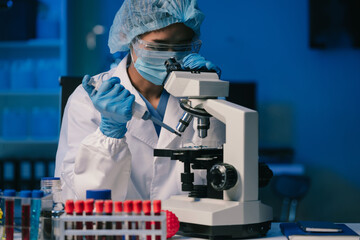 Wall Mural - scientist mixing chemical liquids in the chemistry lab. researcher working in the chemical laborator