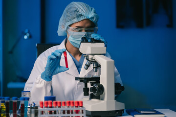 Wall Mural - scientist mixing chemical liquids in the chemistry lab. researcher working in the chemical laborator