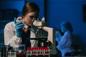 Wall Mural - team scientist mixing chemical liquids in the chemistry lab. researcher working in the chemical labo