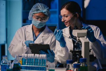 Wall Mural - team scientist mixing chemical liquids in the chemistry lab. researcher working in the chemical labo