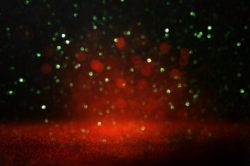 Wall Mural - background of abstract red, gold and black glitter lights. defocused. banner