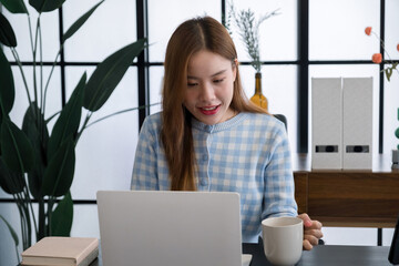 Young woman taking a break from office work.