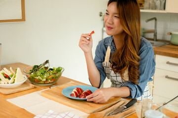 A young woman eating an apple