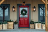 Welcoming red front door with christmas decorations and lanterns illuminating a cozy farmhouse style home entrance