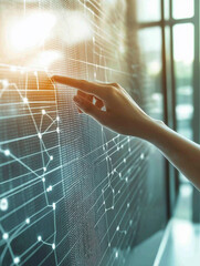 A hand reaching for a holographic computer screen with data and programming code