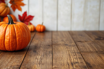 Poster - Pumpkins and fall leaves are framing a rustic wooden tabletop, perfect for showcasing your fall-themed creations
