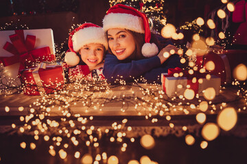 Sticker - Portrait of two people mother daughter lying floor toothy smile festive christmas time illumination flat indoors