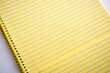 © Hugnaka - High angle view of yellow legal ruled notebook pad paper