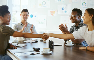 Canvas Print - Business people, handshake and meeting with applause for hiring, teamwork or deal together at office. Group, colleagues or employees shaking hands for contract agreement or recruiting at workplace