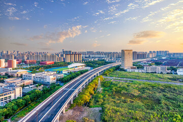 Sticker - Viaduct road and cityscape in modern city at sunset