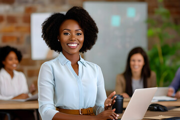 Smiling African businesswoman with curly hair in white blouse leading a meeting with colleagues in a modern boardroom. Business, leadership, startup concept.