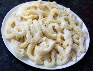 Beef tripe (bucho), beef stomach, tripe on a white plate. Dobradinha