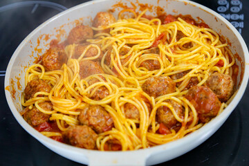 Wall Mural - Traditional spaghetti with tomato sauce and meatballs and grated parmesan cheese