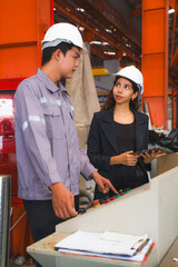 A female expertise engineering manager or inspector and Mechanic or technician are checking or examining the quality of metal sheet machine of industry, manufacturing or factory, Business successful.