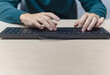 © Cristian Borrego  - Close up businessman hands using a computer in the office, front view, typing the keyboard, business concept