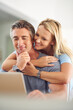 © ArcursForPI/peopleimages.com - Home, mature couple and smile with laptop for insurance cover, online research and information. House, woman and man with planning for investment, financial review and happy wife for support with hug