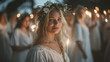 © tiagozr - Woman with candle at Midsummer celebration, outdoors.