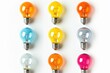 © Ева Поликарпова - A collection of various colored light bulbs arranged on a white background