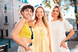 © halayalex - Three young beautiful smiling hipster female in trendy summer stylish clothes. Sexy carefree women posing in the street. Positive models having fun, hugging and going crazy, in sunny day