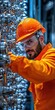 © Arnon  Parnnao - Man in safety gear inspecting machinery in a modern industrial setting.