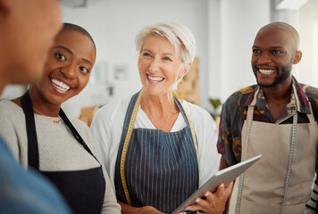 Canvas Print - Creative, smile and discussion for group, fashion designer and planning with tablet, talking and workshop. Tailor, teamwork and people in business meeting, apron and conversation in design studio