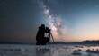 ©  Jovaduplex - Crouched photographer with camera captures Milky Way against vast night sky, evoking creativity and exploration in this profound stargazing scene.