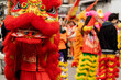 © Komuso & Colorsandia - Red lion dancing among de crowd of people as sign on good luck on a Chinese new year festival