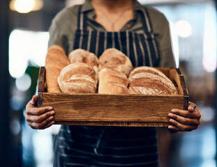 Poster - Bakery, basket and hands of waiter with bread for serving food, products and pastry for small business. Restaurant, cafeteria and person for service, help and baked goods for hospitality in store