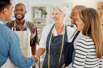 Poster - Creative, handshake and discussion with client, group and agreement in workshop, fashion designer and apron. Tailor, holding hands and people in business meeting and collaboration in design studio