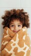 © pier - cute kid wrapped in giraffe towel in cozy bathroom with adorable funny expression