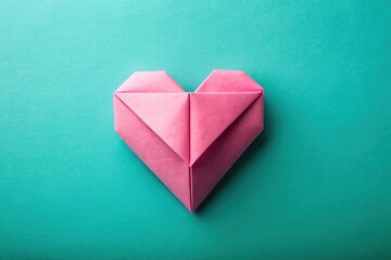 Wall Mural - pink origami heart on turquoise background in paper art style