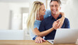 © ArcursForPI/peopleimages.com - Banking, laptop and love with mature couple for investment growth, hug and retirement fund. Financial planning, online and savings with man and woman at home for insurance, taxes or asset management