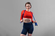 © Summit Art Creations - Full body length gaiety shot athletic and sporty young woman with fitness skipping rope in standing posture on isolated background. Healthy active and body care lifestyle.