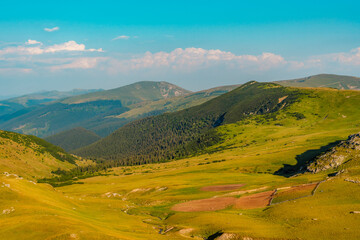 romania transalpina road with many serpentines crossing forest in carpathian mountains. mountains fo
