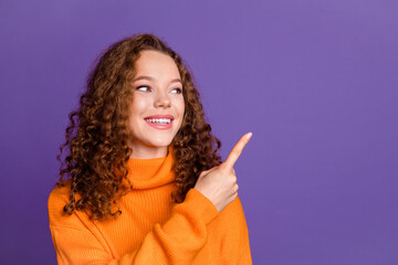 Poster - Portrait of nice young girl look direct finger empty space wear pullover isolated on purple color background