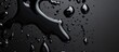 © Ghulam - Black liquid splatter effect with glossy droplets over a dark surface