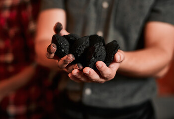 Man, home and hands with coal for barbecuing meat for house party, celebration and gathering. Male person, closeup and apartment for reunion or festive season for grilling food on social event