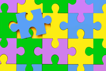 Wall Mural - Many colorful puzzle pieces as background. Symbol of autism