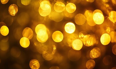 a blurry image of a gold background with a few bright yellow circles