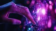 © soysuwan123 - A hand is touching a glowing purple object