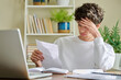 © Valerii Honcharuk - Serious young guy reading letter, paper document