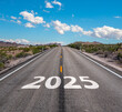 © AA+W - New year 2025 or start straight and beginning concept. number 2025 start written on the road at sunset with lens flare. Concept of challenge or career path, business strategy.