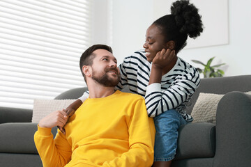 Poster - International relationships. Portrait of lovely couple at home