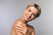 © New Africa - Cosmetology. Beautiful woman with perfect skin on grey background