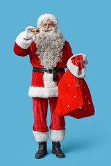 Canvas Print - Santa Claus with tasty burger  on blue background